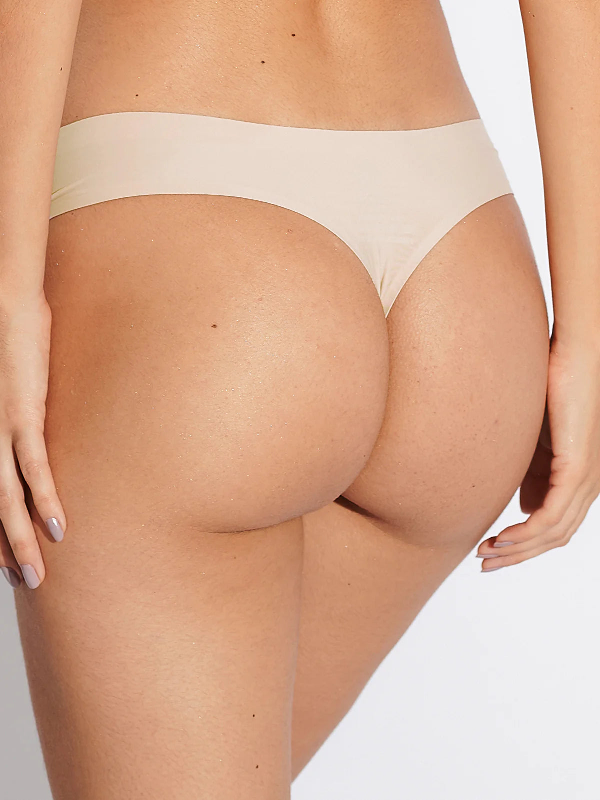 Kit com 3 Calcinhas Fio Dental Sem Costura Segunda Pele Bege - R$23,30 cada